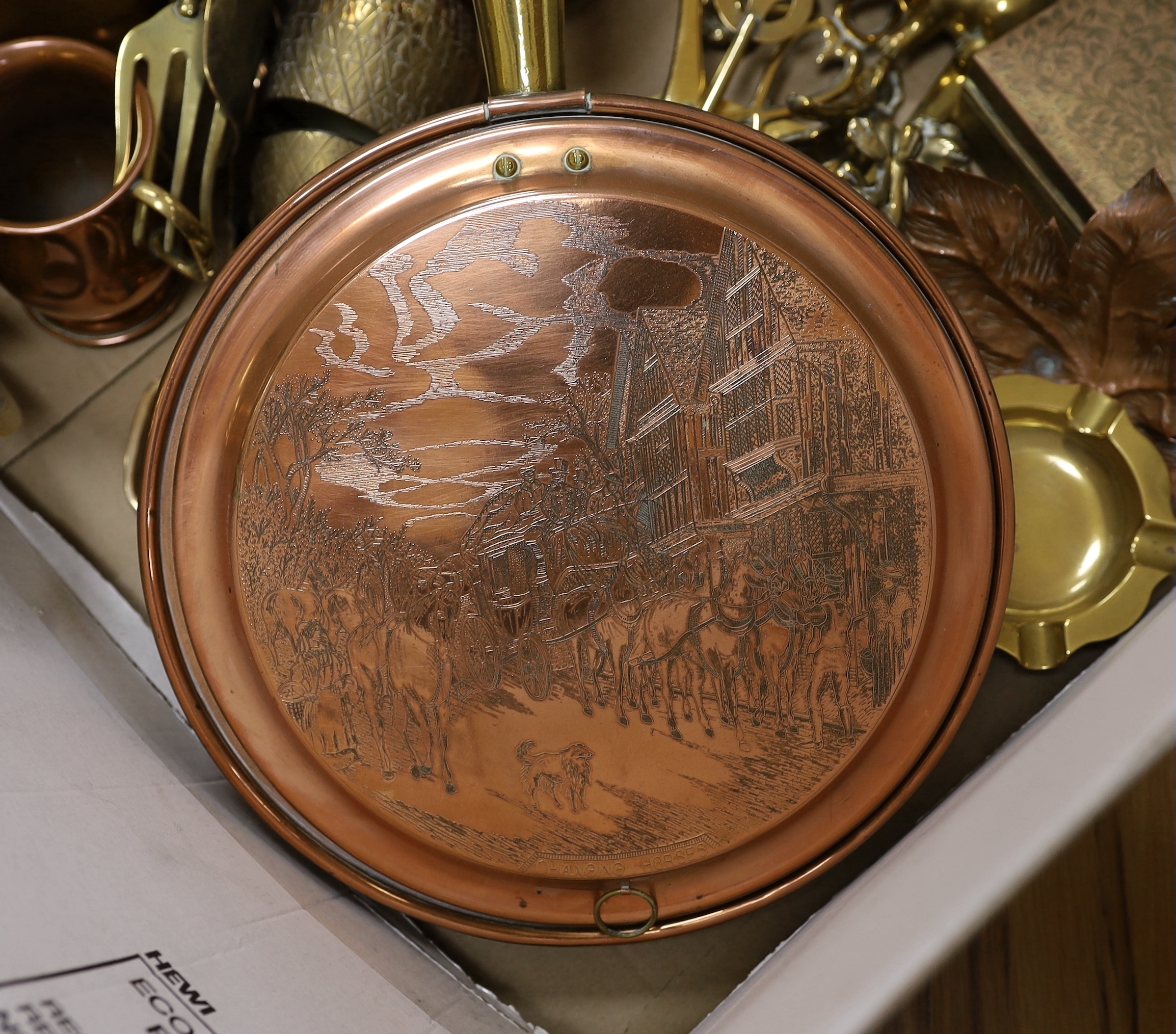 A group of mixed copper and brass including a warming pan, kettle, pot etc
